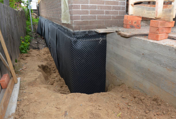 SJ Waterproofing Pros technician performing targeted Foundation Crack Repair assessment in Brownsville, OR